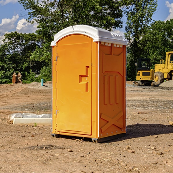 what is the cost difference between standard and deluxe portable restroom rentals in Kingdom City